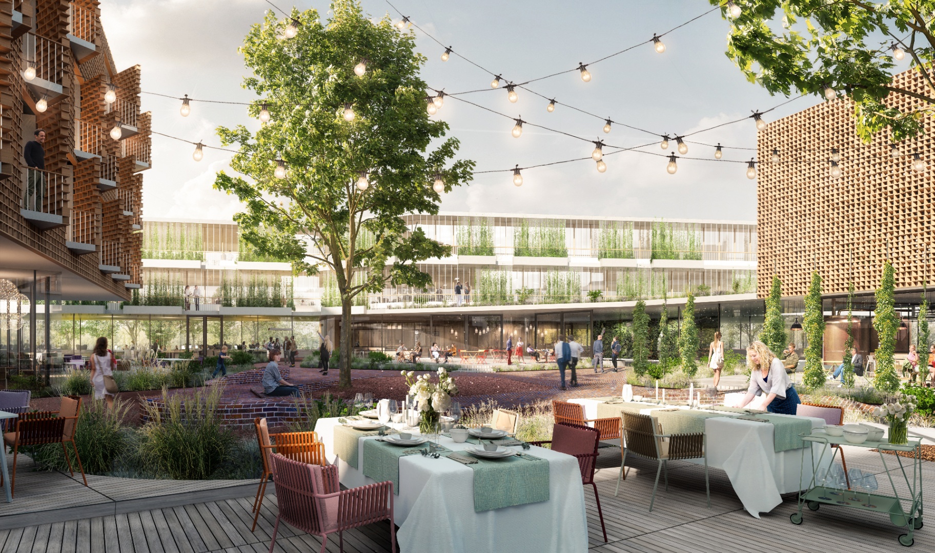 Innenhof des Heyligenstaedt Gewerbeparks in Gießen mit begrüntem Areal, Holzbau-Fassaden und gemütlicher Außengastronomie – Standort der THINKBOX